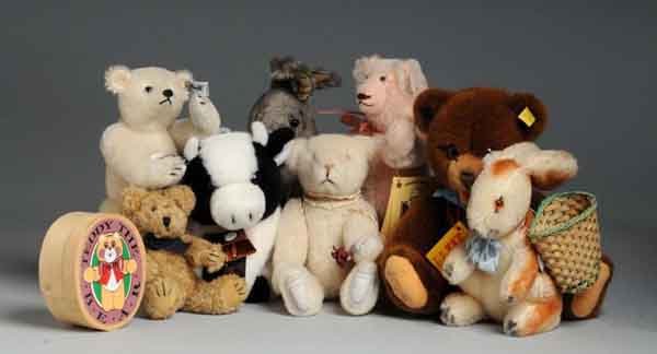 Lot of 12: Stuffed Animals.: Includes Steiff white mohair limited edition Margaret Woodbury Strong Bear #0158/25 with leather paw pads, Steiff brown plush open-mouth bear #0220/30, Grisly mohair bunny with tag, Owassa pink mohair