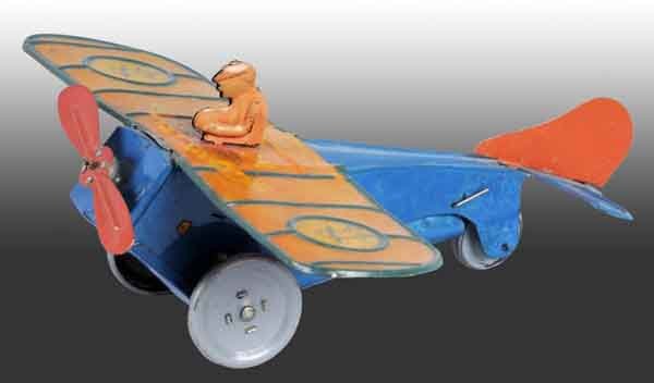 Tin Strauss No. 48 Scout Flyer Wind-Up Toy.: Working. Marked "The Ferdinand Strauss Corporation" and pictures of boy scouts on wings. Includes original pilot. Moderate overall scratching and wear with some fading to wing. 8" L. (Very Good).