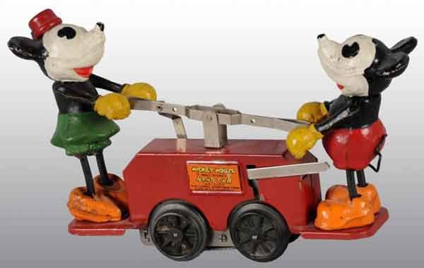 Lionel Mickey & Minnie Mouse Wind-Up Handcar Toy.: American. Working. Red color variation. Figures are made of composition and handcar is tin. Mickey and Minnie's rubber legs have been replaced and Minnie is missing her tail. Some scratching and paint