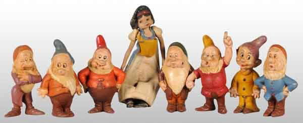 Rubber Walt Disney Snow White & the 7 Dwarfs Set.: Snow White is hard-to-find in any condition. The dwarves have some crazing and wear and Snow White shows considerable wear. Snow White: 8" T. (Good - Very Good).