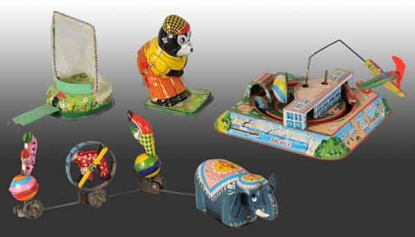 Lot of 3: Tin Wind-Up Toys.: Japanese. All are working. Includes one TPS Elephant Parade, one Golfing Bear, and one Air Terminal toy with original airplane. Moderate wear overall. (Very Good).