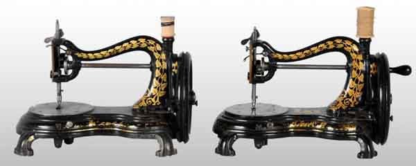 Lot of 2: Cast Iron English Sewing Machines.: Circa 1885. Both by Jones of Manchester, England. Both are working with gold vine decoration. Each: 13" x 10". (Excellent).