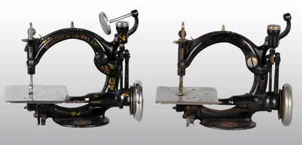 Lot of 2: Cast Iron Child's Toy Sewing Machines.: Both by National. Unusual circular arms. Both are working. Each: 10" x 8". (Excellent).