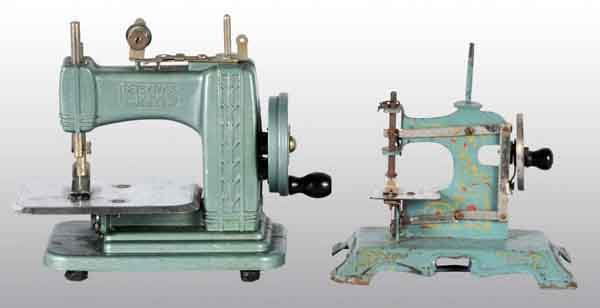 Lot of 2: Metal Child's Toy Sewing Machines.: Includes one German machine and one Betsy Ross. Both are working. No damage or repairs. Largest: 7 - 1/2" x 7". (Excellent).