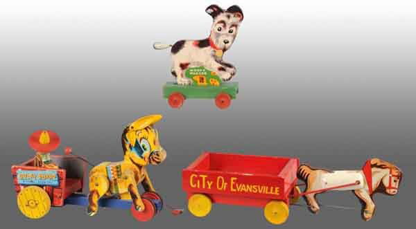 Lot of 3: Fisher Price Animal Pull Toys.: American. 1950s. Includes one Bucky Burro, one Woofy Wagger, and one Pony Express that has been custom painted to say "City of Evansville". Largest: 9 - 1/2" T. (Very Good).