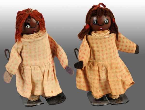 Lot of 2: Fisher Price Hot Mammy Wind-Up Toys.: American. Both are working. Original clothing with some fading. Both: 6" T. (Good - Very Good).