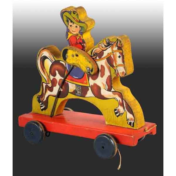 Fisher Price No. 430 Buddy Bronc Toy.: American. 1938. Working. Some moderate edge wear and replaced nails on the cowboy's legs. 9" L. (Very Good - Excellent).