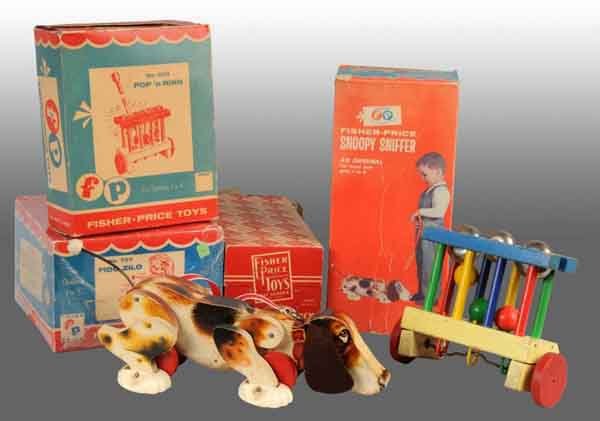 Lot of 4: Fisher Price Toys & Original Boxes.: American. Includes two Fisher Price toys, consisting of the Pop 'n Ring and Snoopy Sniffer, in their original boxes. Lot also includes two original boxes only for the Looky Fire Truck and no. 707 Fido