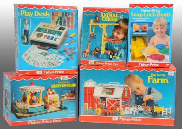 Lot of 5: Fisher Price Toys.: American. 1960s to 1970s. Includes one Play Farm, one Merry-Go-Round, Circus Animals, Play Desk, and Snap-Lock boats. Includes all original boxes with some creasing and wear. Largest: 17" L. (Very Goo