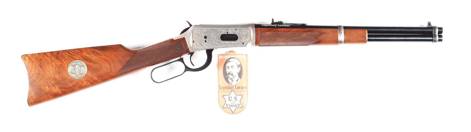 (M) WINCHESTER LEGENDARY LAWMEN MODEL 94 LEVER ACTION: Based on the classic Winchester '94 rifle, this 1977 vintage saddle ring carbine commemorates the legendary Lawman of the American West. It features a 16" trapper length blued barrel with full length 