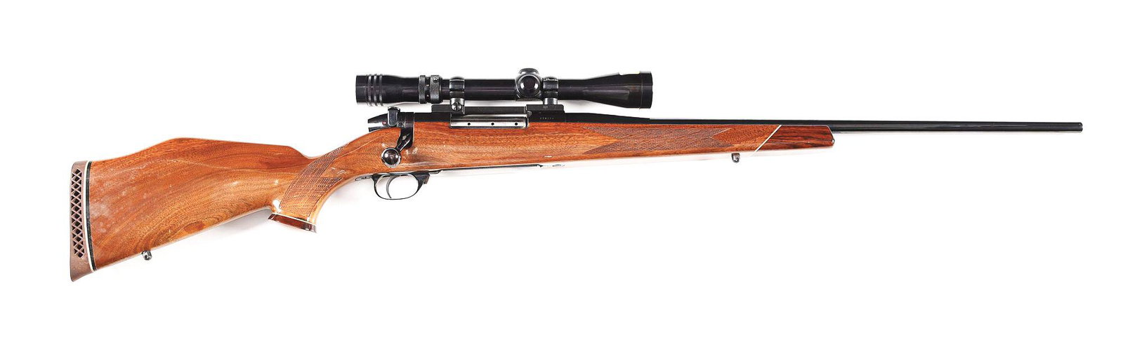 (M) WEATHERBY MARK V .300 WIN MAG BOLT ACTION RIFLE: A bolt action rifle with round blued steel barrel without sights, fluted bolt body, and steel hinged floorplate with release on front of trigger guard. A Redfield 3-9x scope with 1 piece Redfield base