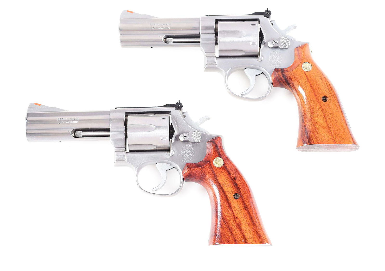 (M) LOT OF 2: SMITH & WESSON MODEL 686 CAPTAIN DAN: Lot consists of (A) Smith & Wesson Model 686 Captain Dan Combs Commemorative double action revolver with case. Made circa 1986. Left side of the barrel is marked "SMITH & WESSON/.357 MAGNUM", while th