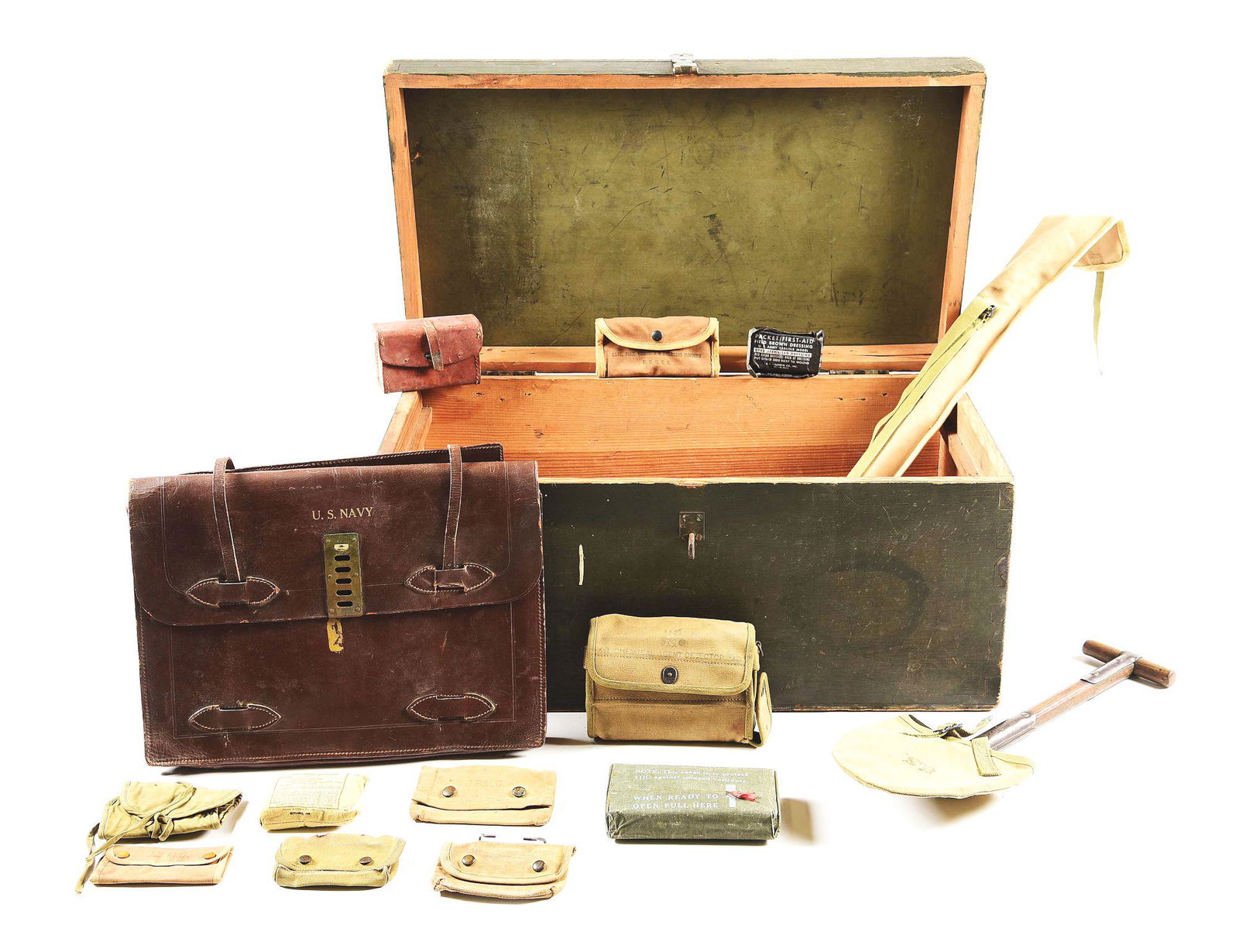 LARGE AND ESXTENSIVE LOT OF WORLD WAR II ERA USMC FIELD: Extensive lot of USMC field gear that dates from the World War I era that dates through the World War II era. The lot includes 3 mess kits from the World War I era, 4 entrenching tools, 1 is a rare Wo