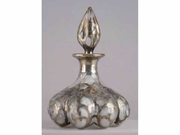 Sterling Silver Overlay Glass Perfume Bottle.: Clear glass with cloudiness to the bottle. No damage or cracks. Original stopper. 5" T.