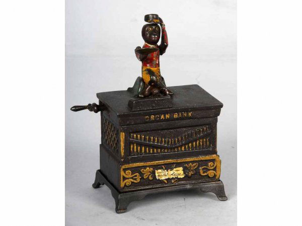 Cast Iron Organ Mechanical Bank.: Manufactured by Kyser and Rex Company. Working. Excellent paint. Missing trap.