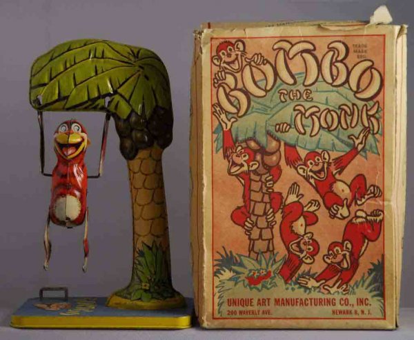 Unique Art Tin Wind-Up Bombo the Monk Toy.: Toy includes original box. Nice tin lithography. Wind-up working. Monkey swings around tree. Box is complete but it has one inside flap detached but present. Some tearing and creasing to box. 10 - 1/2