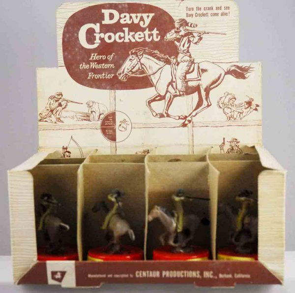 Original Store Display for Davy Crockett Toys.: Circa 1950s. Made by Scentaur Productions Incorporated, California. Unsold, unused case of twelve 4" T plastic and rubber Davy Crockett toys. When turned on bottom Davy Crockett and horse move. Horse