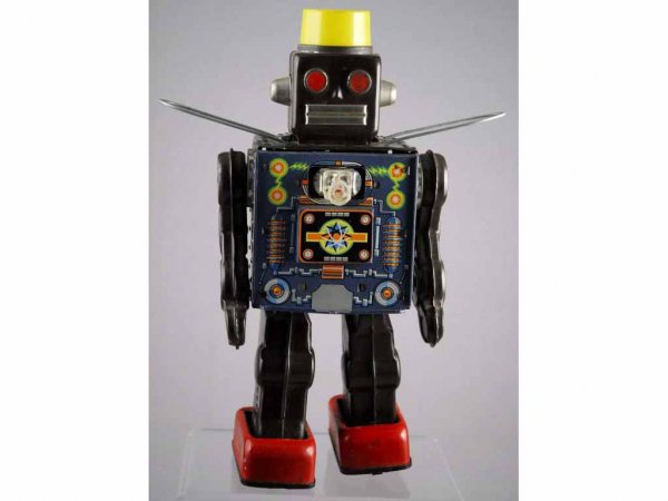 Japanese Battery-Operated Machine Gun Robot.: Circa 1950s. Made by SN. Missing plastic chest plate. Working. 12" T.
