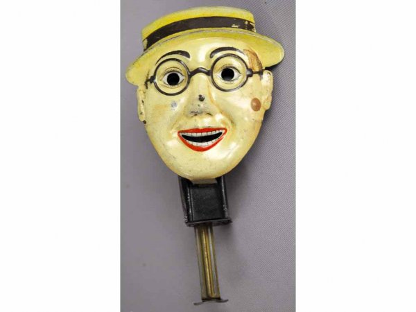 Pre-War German Tin Harold Lloyd Sparkler Toy.: Nice lithography. Spot of paint on left side of cheek, otherwise minor wear throughout. Working. 5 - 1/2" T.