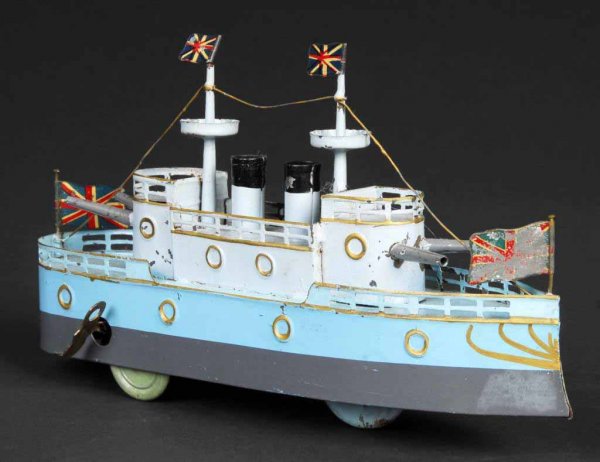 Tin Hand-Painted Battleship Wind-Up Toy.: Japanese. Working. Includes three original British flags. All original. 10" L.
