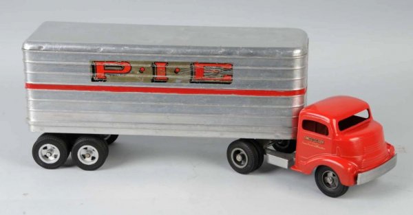 Pressed Steel Smith-Miller PIE Truck Toy.: American. Nice decals on both sides of front cab. Front bumper is intact and cab is possibly repainted. Decals are somewhat worn. 24" L.