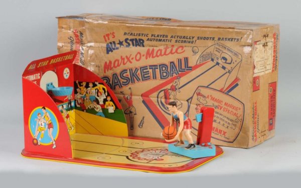 Marx All Star Basketball Game.: American. Working. Tin base with plastic figure. Includes ball, but is not original to this toy. Some spidering and pitting to litho on base. Includes original complete box with tape throughout. 22" x