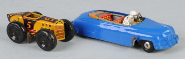 Lot of 2: Marx Car Wind-Up Toys.: American. One plastic and one metal. Plastic car has reversible side to transform from convertible to coupe. Tin car is missing driver. Largest: 8" L.