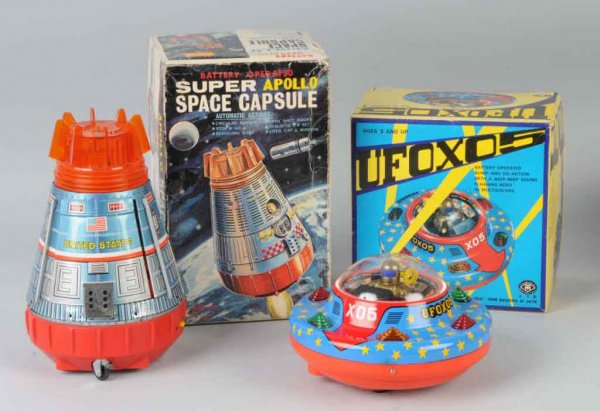 Lot of 2: Space Battery-Op Toys.: Japanese. Working. One is an Apollo Space Capsule and the other a UFO X05. Includes both original boxes with some creasing. Largest: 10 - 1/2" x 6" x 6 - 1/2".