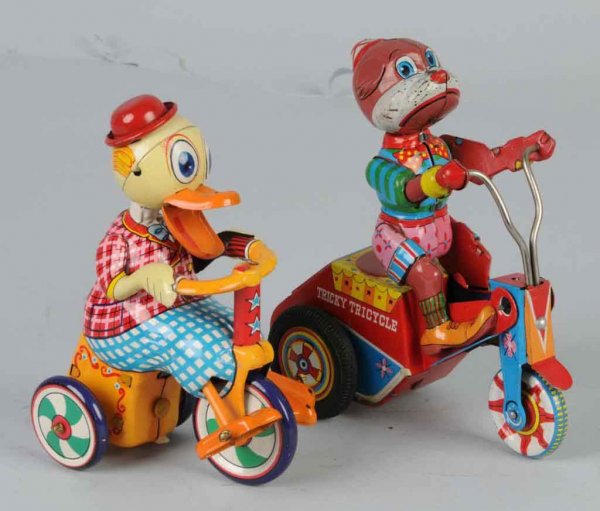 Lot of 2: Tin Animal Friction & Wind-Up Toys.: Japanese. Working. Includes one duck and one dog, both on tricycles. Nice, colorful lithography. Largest: 6" L.