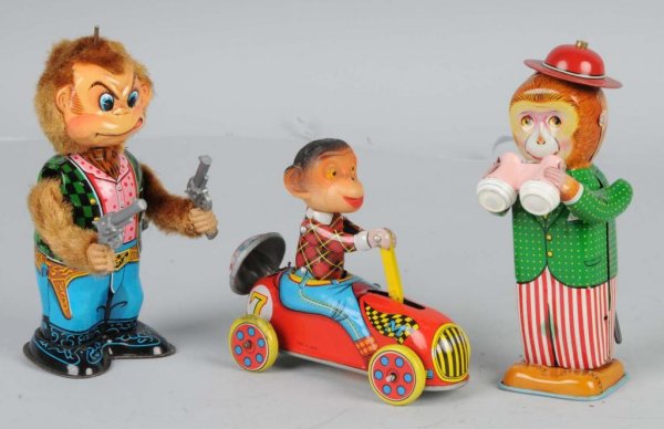 Lot of 3: Tin Litho Monkey Wind-Up Toys.: Japanese. Working. Includes one with binoculars, one driving an Irish Mail, and one with pistols, missing hat. Largest: 6" T.