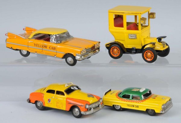 Lot of 4: Tin Taxi Friction Toys.: Japanese. Working. Nice lithography. Two with original price stickers on roofs. Largest: 7 - 1/4" L.