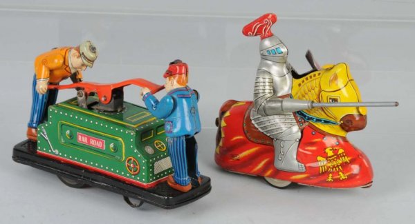 Lot of 2: Tin Wind-Up Toys.: Japanese. Working. Includes one Hoji Knight and one Tom & Dick Railroad Car. Nice lithography throughout. Each: 5" L.