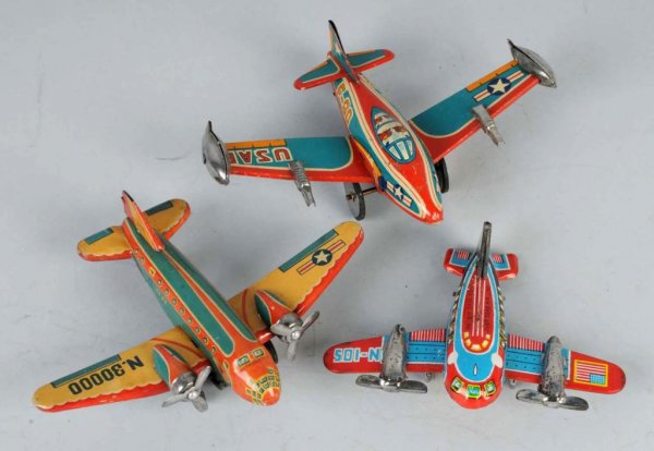 Lot of 3: Tin Airplane Friction Toys.: Japanese. Working. One military and two commercial. Nice, colorful lithography. Largest: 4 - 1/2" x 6".