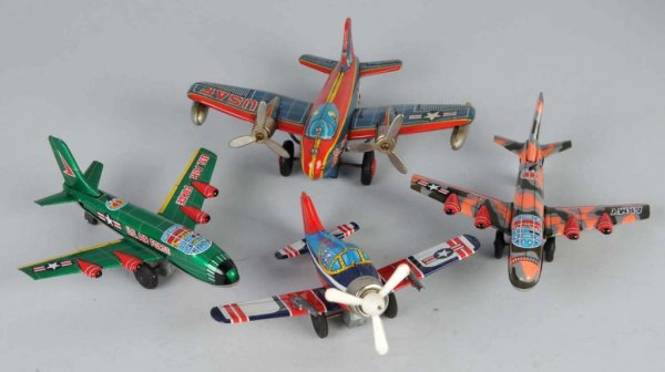 Lot of 4: Tin Airplane Friction Toys.: Japanese. Working. All military. Nice lithography throughout. Largest: 7" x 8".