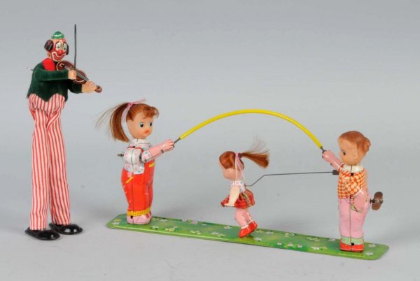 Lot of 2: Tin TPS Wind-Up Toys.: Japanese. Working. Includes one clown violinist and one girl skipping rope. Largest: 5 - 1/2" x 12 - 1/2".