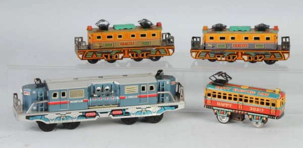 Lot of 4: Tin Friction Train Toys.: Japanese. Working. Nice lithography. Largest: 11" L.