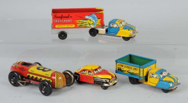 Lot of 4: Tin Litho Lupor Vehicle Toys.: Three friction and one wind-up. Includes one race car, two trucks, and one police car. Nice, colorful lithography. Largest: 8 - 1/2" L.