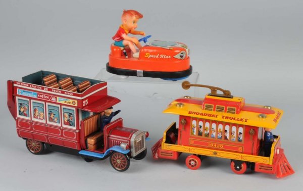 Lot of 3: Tin Vehicle Battery-Op Toys.: Japanese. Working. Includes one Double Decker bus, one Broadway Trolley, and one Speed Star Bumper car with vinyl driver. Largest: 13" L.