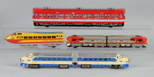 Lot of 4: Tin Litho Train Toys.: Japanese. Three friction and one battery-op. Excellent lithography. Largest: 17" L.