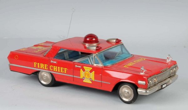 Tin Fire Chief Car Friction Toy.: Japanese. Significant amount of rust on rear bumper and spidering to the lithography. 17" L.