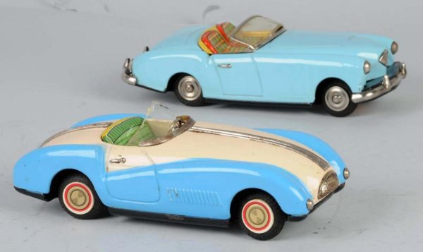 Lot of 2: Tin Convertible Auto Friction Toys.: Japanese. Working. Includes one scarce Kaiser and one Cunningham. One windshield is detached but present. Some scratching and wear throughout. Largest: 8" L.