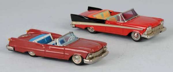 Lot of 2: Tin Automobile Friction Toys.: Japanese. Working. Includes one Plymouth Fury and one Chrysler Imperial. Some slight spidering to lithography on Imperial. Each: 8 - 1/4" L.
