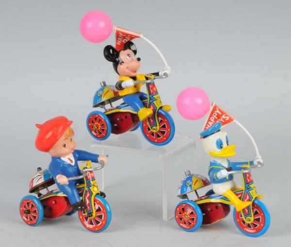 Lot of 3: Tin & Vinyl Tricycle Wind-Up Toys.: Korean. Working. Includes one Donald Duck, one Mickey Mouse, and one boy. Each: 4 - 1/2" L.