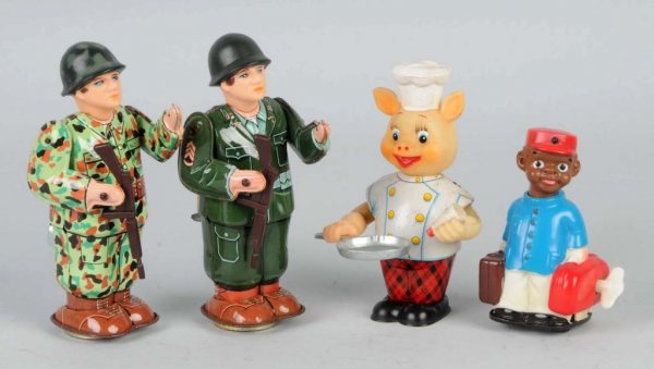 Lot of 4: Tin & Vinyl Wind-Up Figural Toys.: Working. Includes one piggy cook with eggs, one porter, and two soldiers. Largest: 6" T.