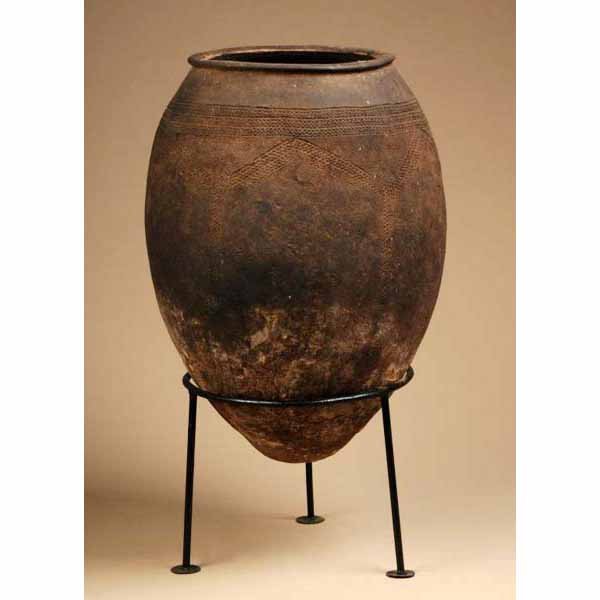 West African Food Storage Container.: From Mali. Made of clay. Base not included with piece. 27" T.