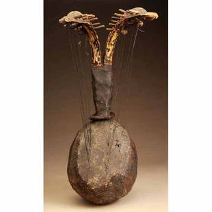 African Guitar with 2 Rhino Tusks.: Made of wood, metal, and leather. 25" L.