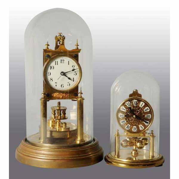 Lot of 2: German Skeleton Clocks.: Both metal with glass domes. One is a Gustav Becker. Largest: 12" T.
