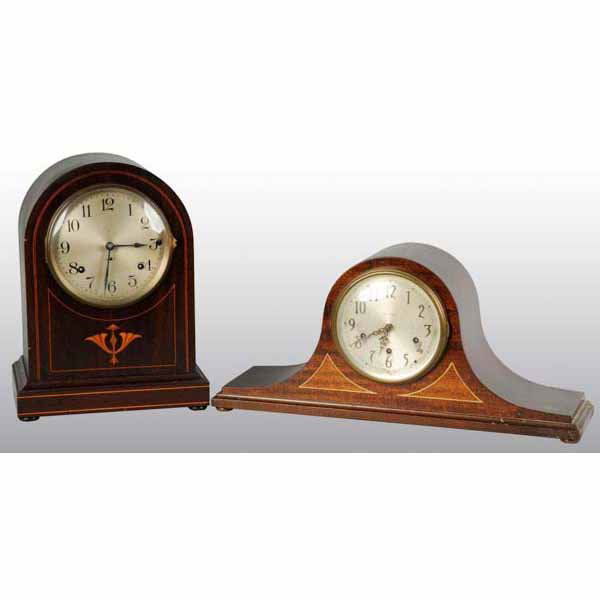 Lot of 2: Wooden Seth Thomas Mantle Clocks.: Both are time and strike with pendulums. One has some inlay work. Largest: 14" T.
