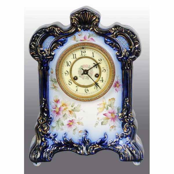 Waterbury Time & Strike Flow Blue China Clock.: With pendulum. Wonderful deep blue color with floral pattern. 13" T.
