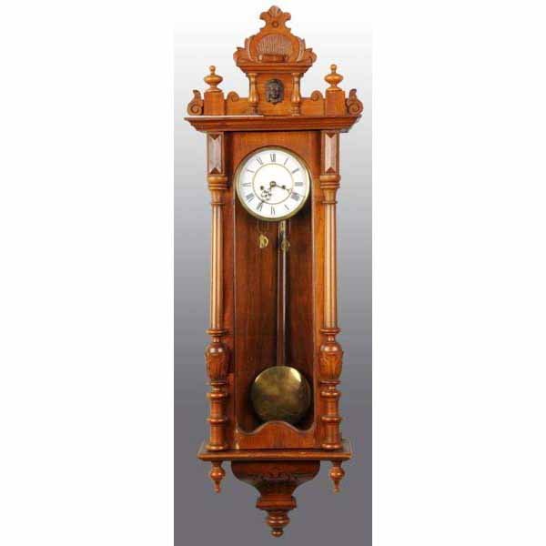 Ornate German Time & Strike Wall Clock.: With pendulum and two weights. 38" T.